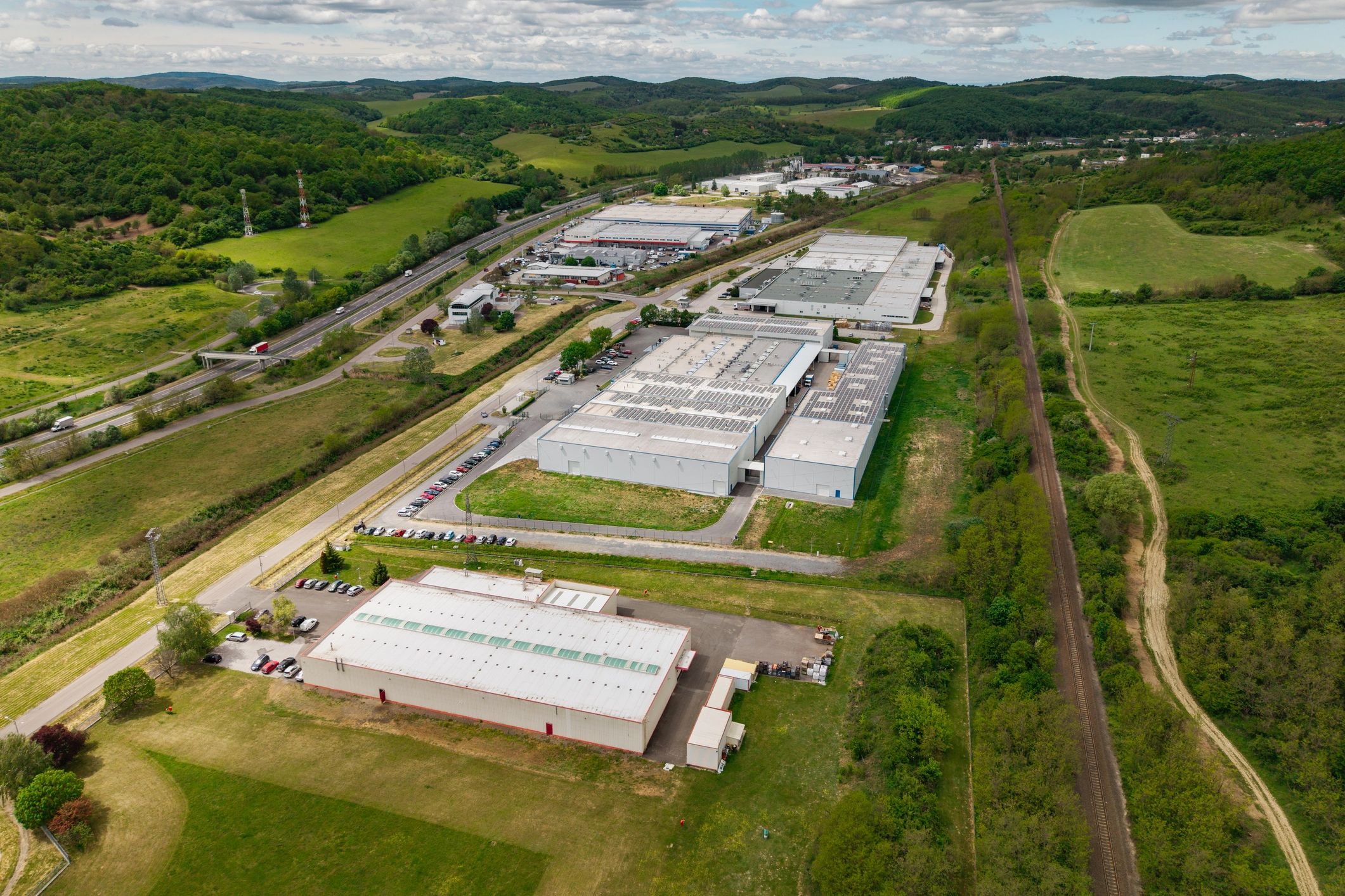 Modern industrial infrastructure representing portfolio scale and oversight